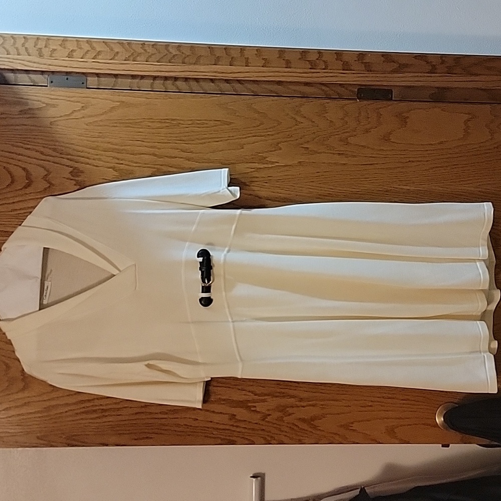 Light weight , cream color dress, with attached slip.